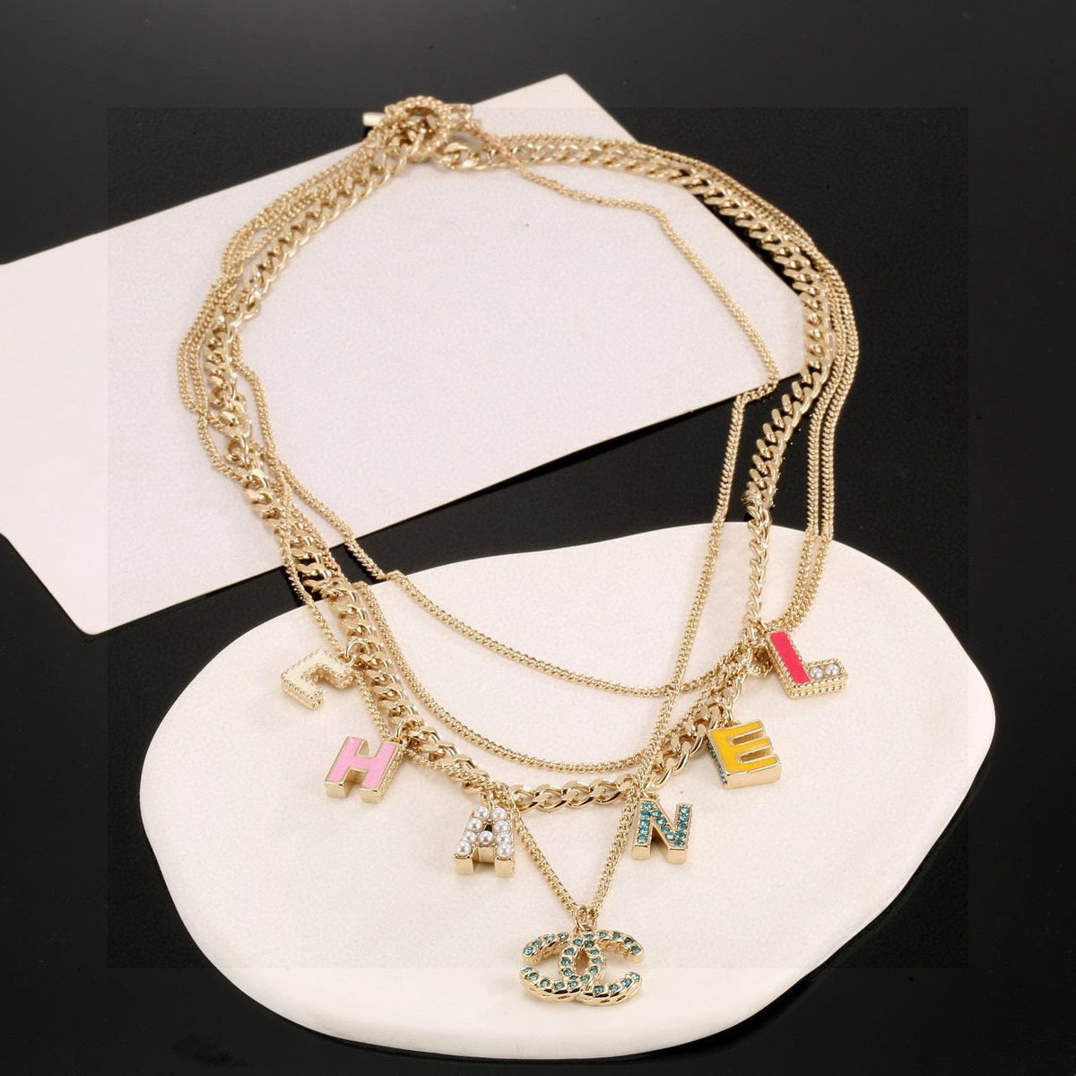 Martin Graham pendant necklace in polished metal-tone – front product view