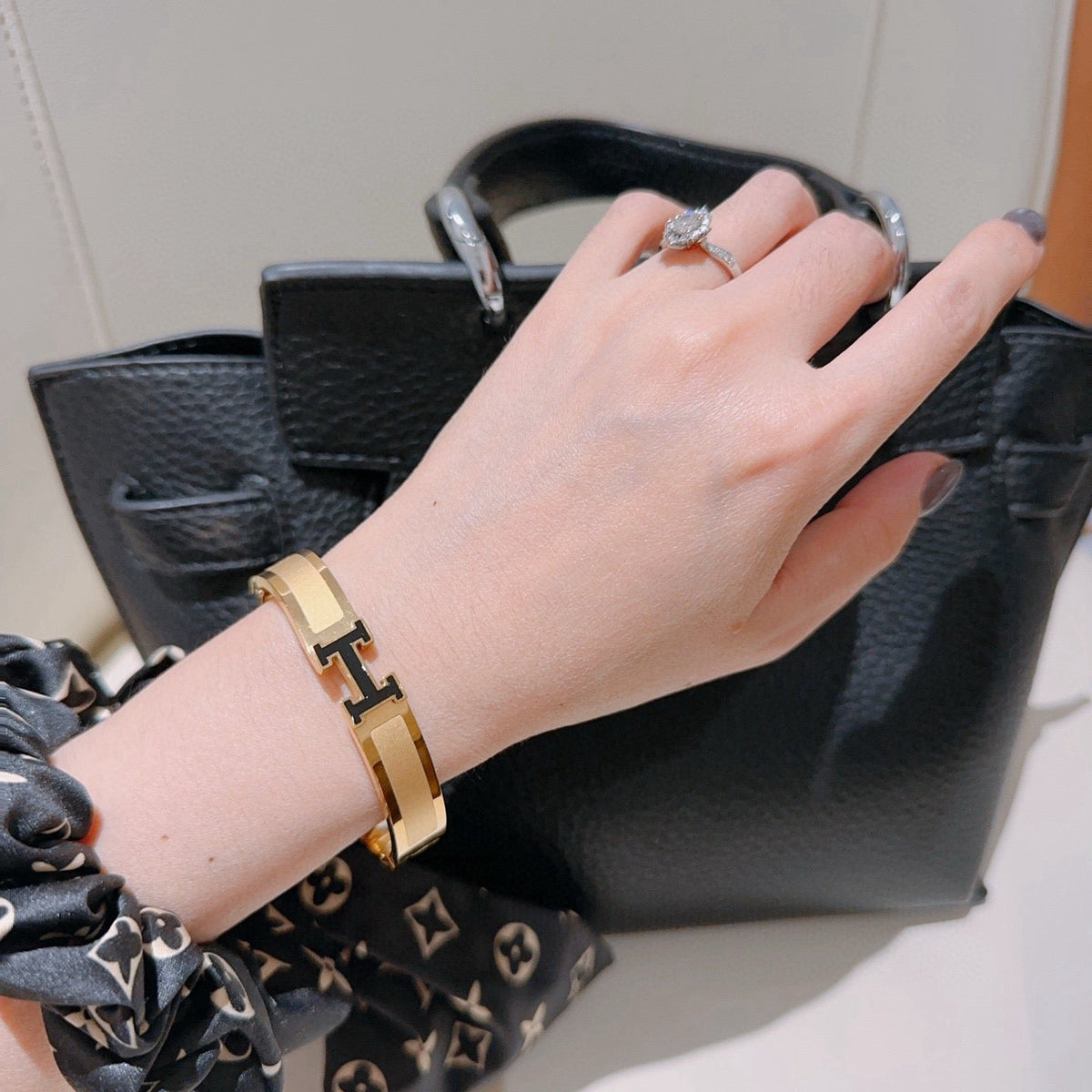 Martin Graham bangle in polished metal-tone – styled product view