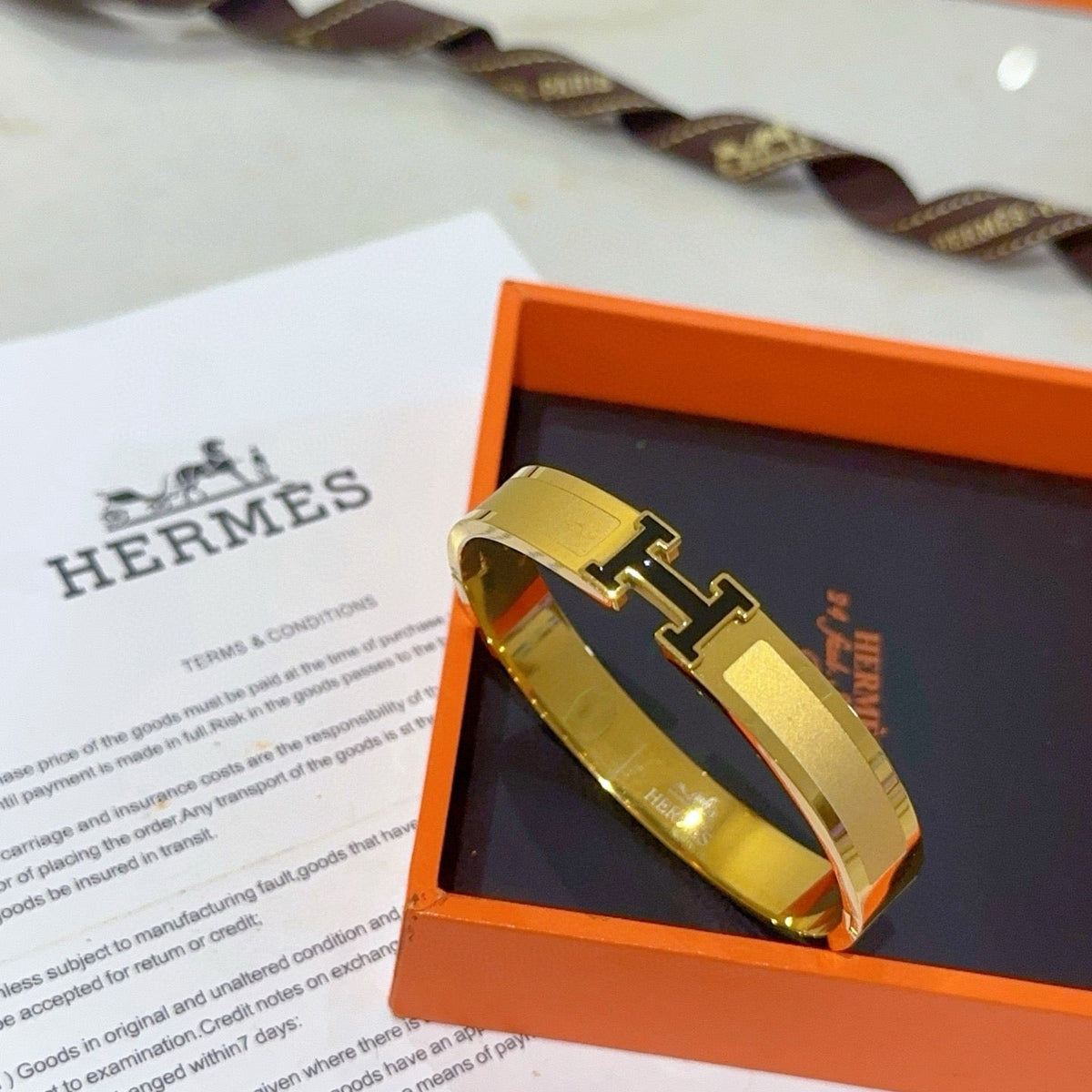 Martin Graham bangle in polished metal-tone – front product view