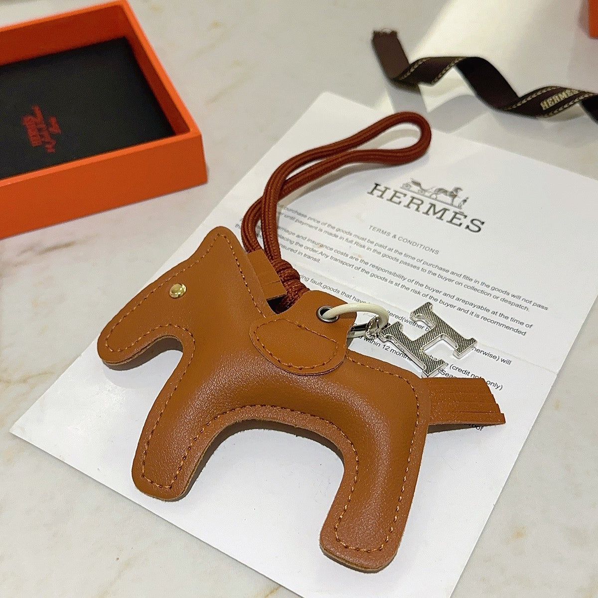 Martin Graham keychain in polished metal-tone – detail view