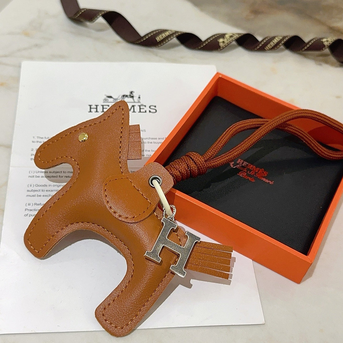 Martin Graham keychain in polished metal-tone – close-up detail