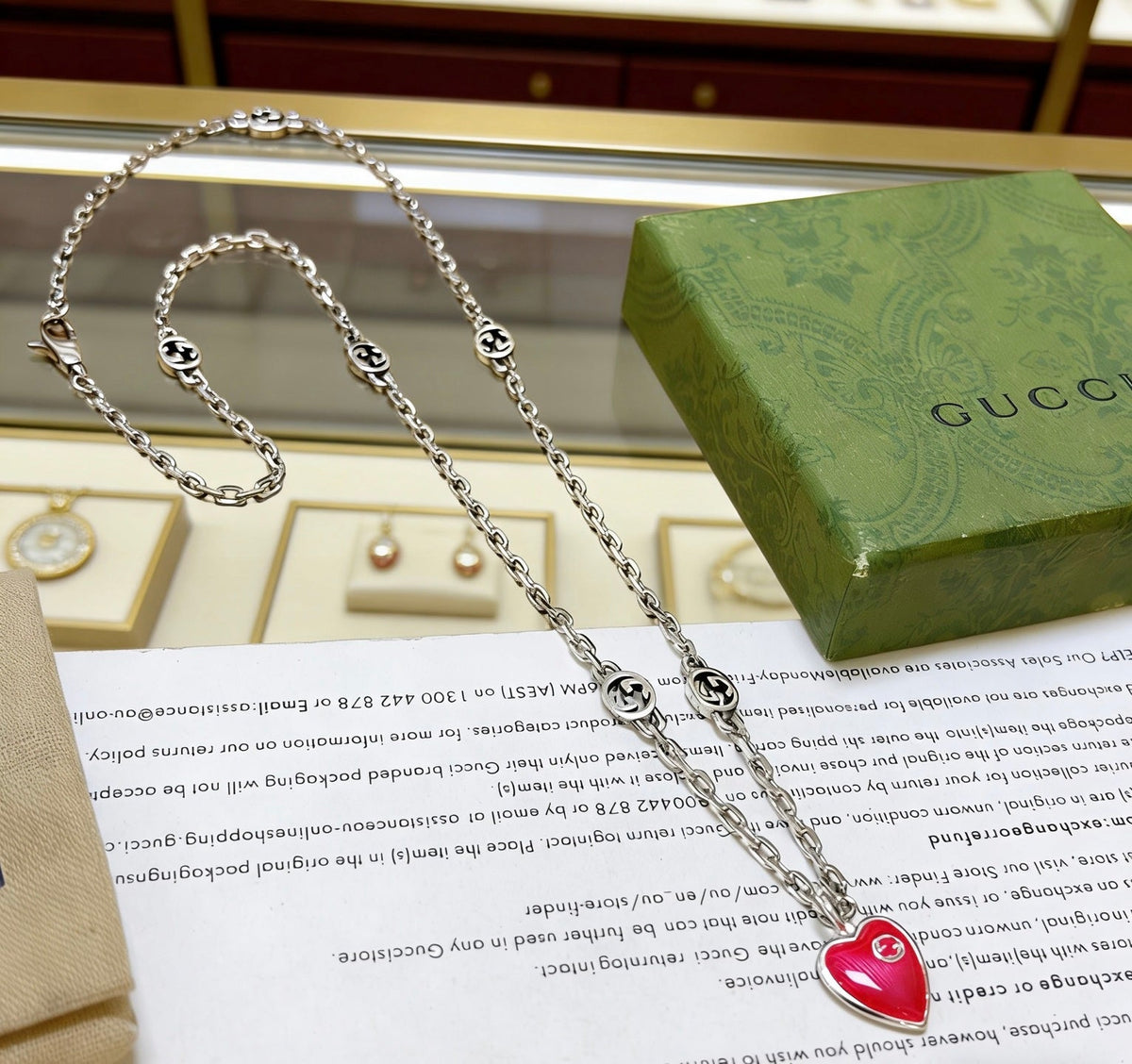 Martin Graham pendant necklace in polished metal-tone – close-up detail