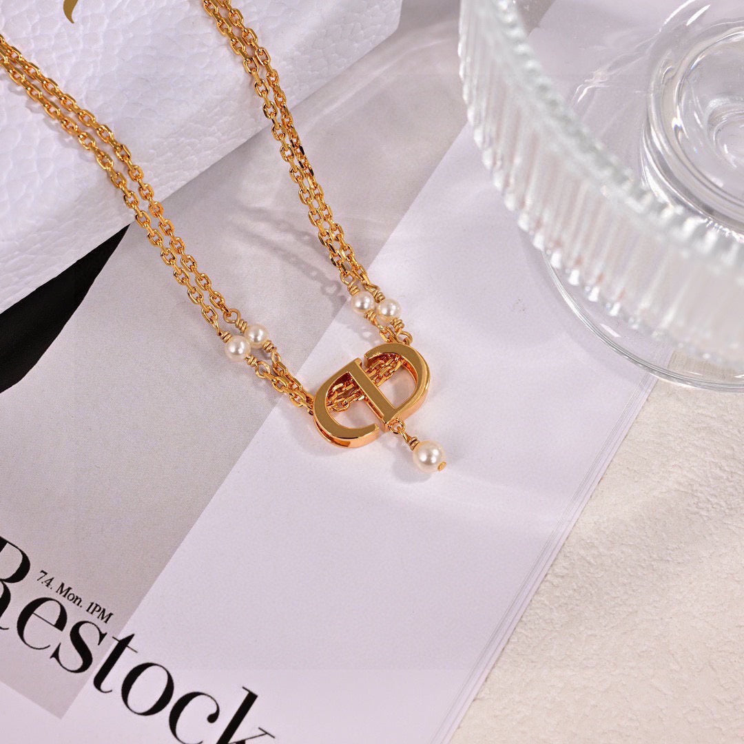 Martin Graham pendant necklace in polished metal-tone – front view
