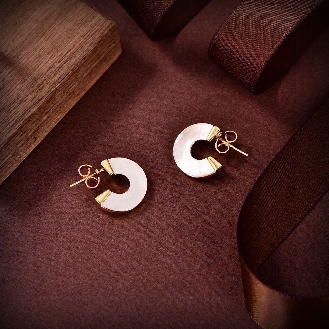 Martin Graham stud earrings in polished metal-tone – styled product view