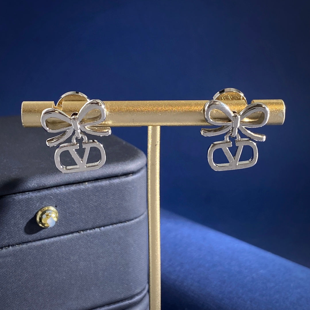 Martin Graham stud earrings in polished metal-tone – detail view