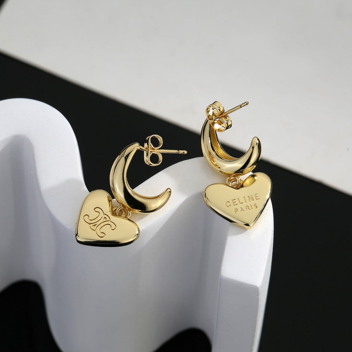 Martin Graham stud earrings in polished metal-tone – front view