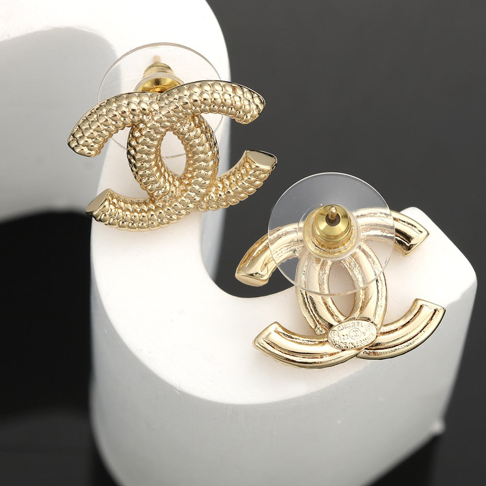 Martin Graham stud earrings in polished metal-tone – side detail