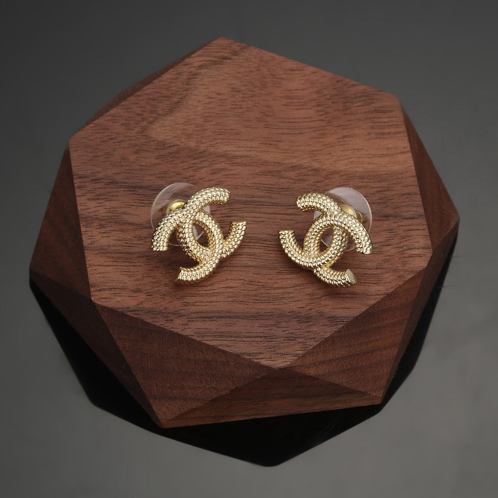 Martin Graham stud earrings in polished metal-tone – front product view