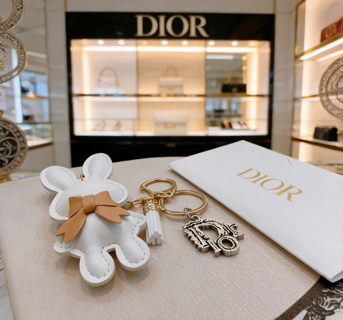 Martin Graham bag charm in polished metal-tone – close-up detail