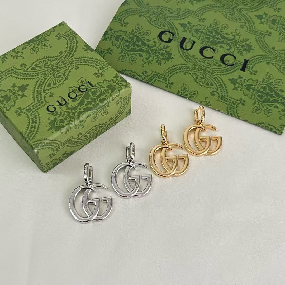 Martin Graham stud earrings in polished metal-tone – front product view