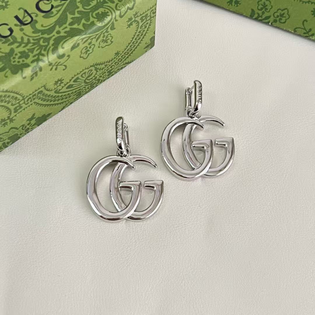 Martin Graham stud earrings in polished metal-tone – front product view