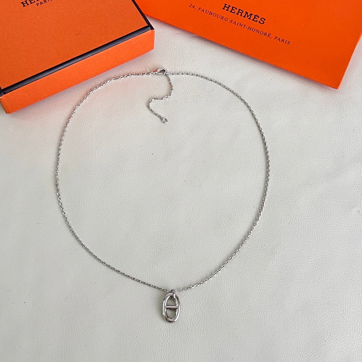 Martin Graham pendant necklace in polished metal-tone – side detail