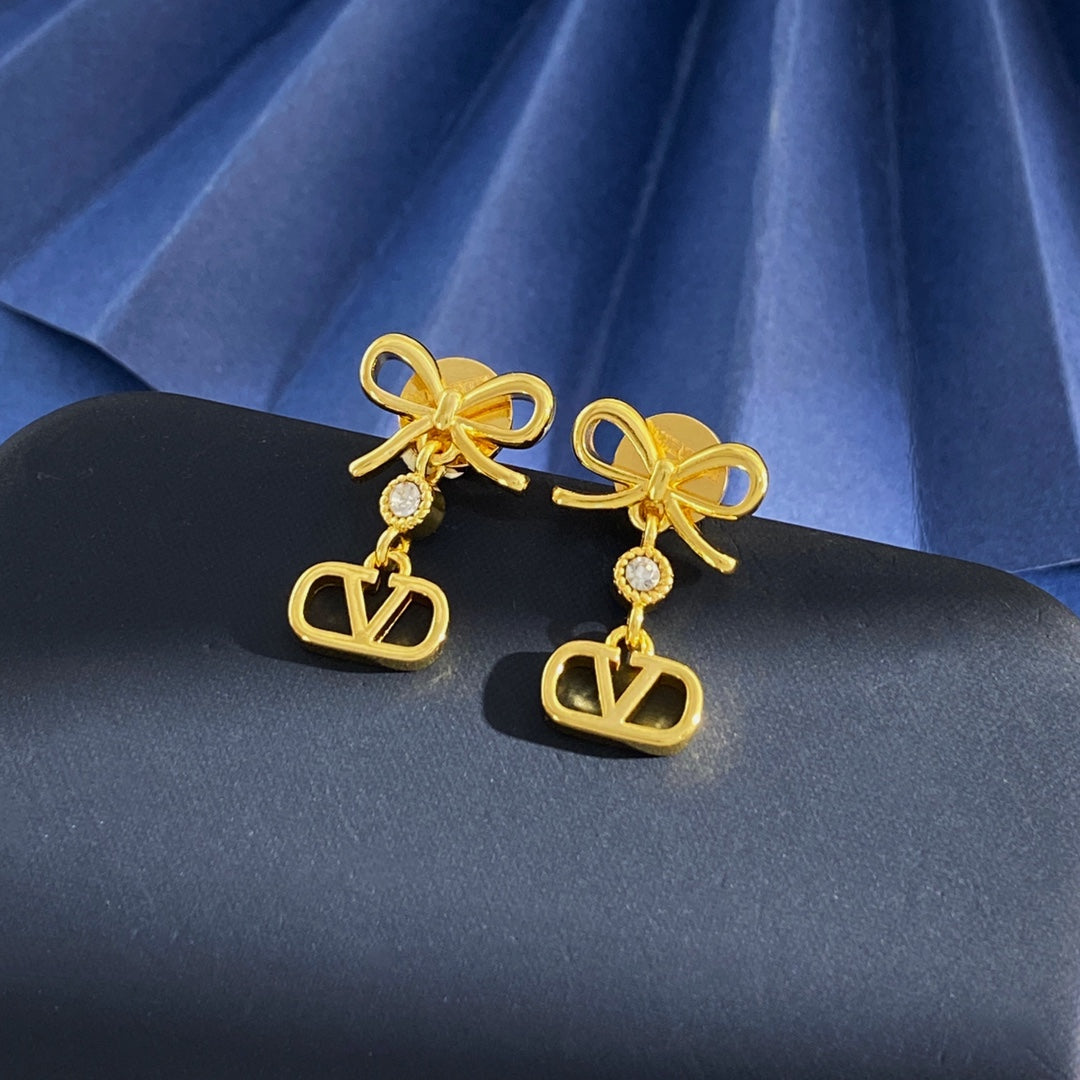 Martin Graham stud earrings in polished metal-tone – front view
