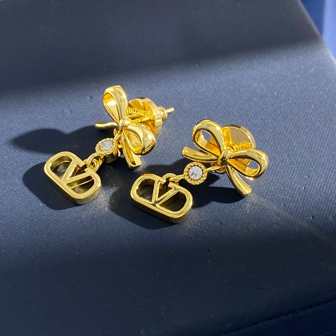 Martin Graham stud earrings in polished metal-tone – side detail