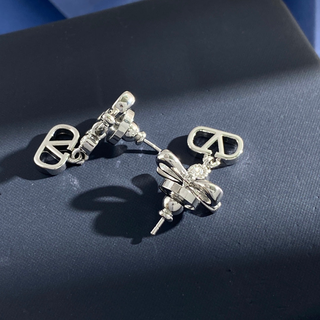 Martin Graham stud earrings in polished metal-tone – detail view