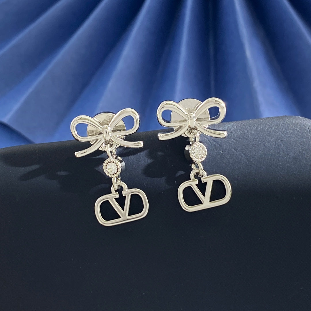 Martin Graham stud earrings in polished metal-tone – detail view