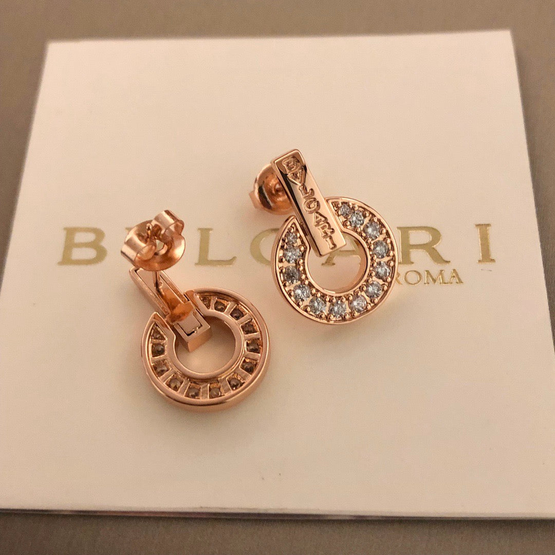 Martin Graham stud earrings in polished metal-tone – front product view
