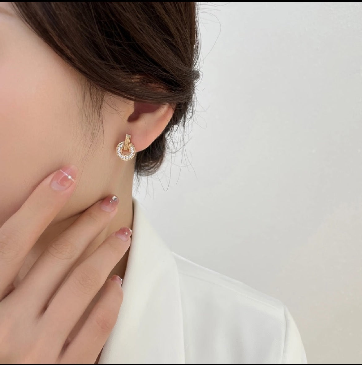 Martin Graham stud earrings in polished metal-tone – styled product view