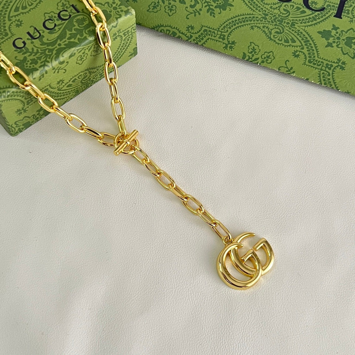 Martin Graham pendant necklace in polished metal-tone – detail view