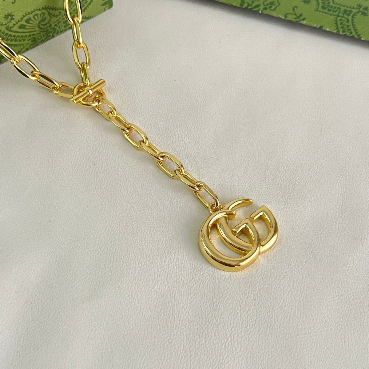 Martin Graham pendant necklace in polished metal-tone – close-up detail
