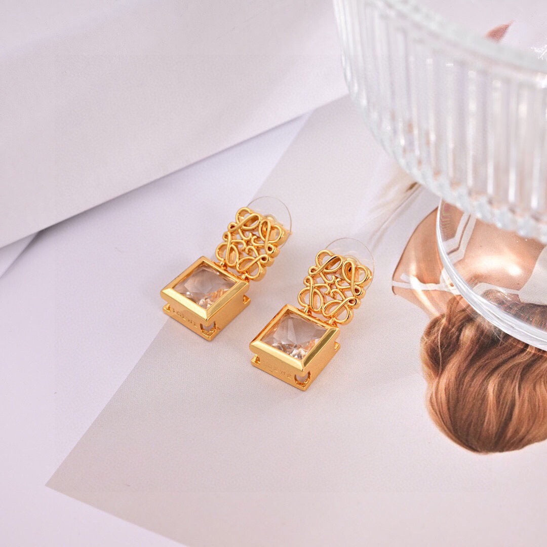Martin Graham stud earrings in polished metal-tone – detail view