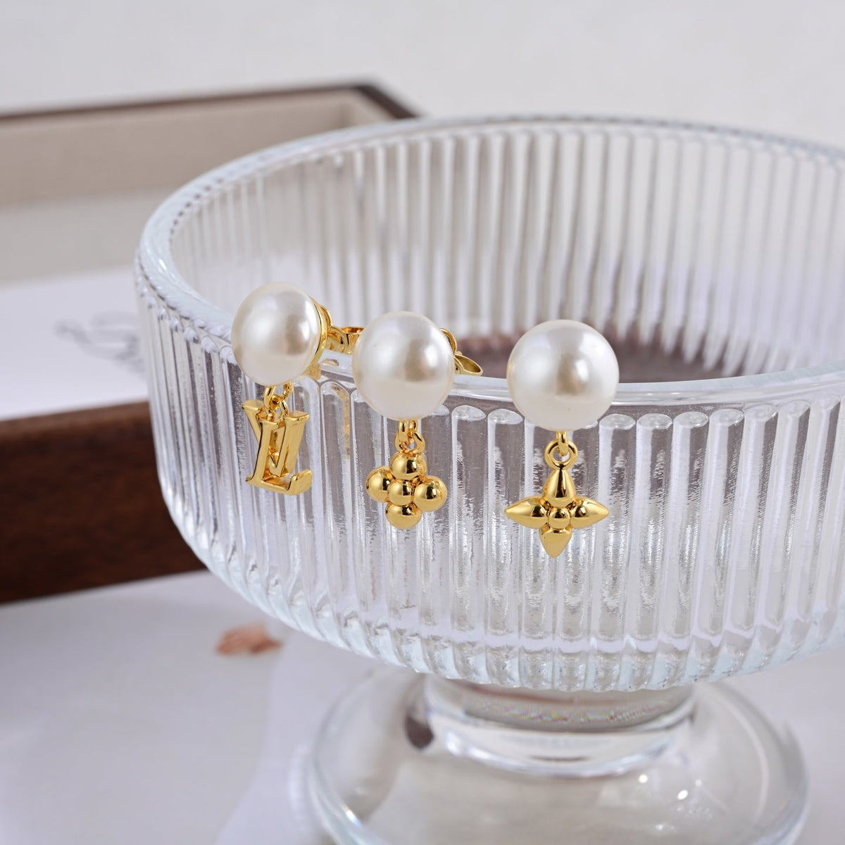 Martin Graham stud earrings in polished metal-tone – styled product view