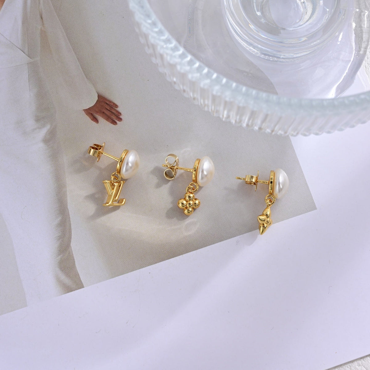 Martin Graham stud earrings in polished metal-tone – front product view