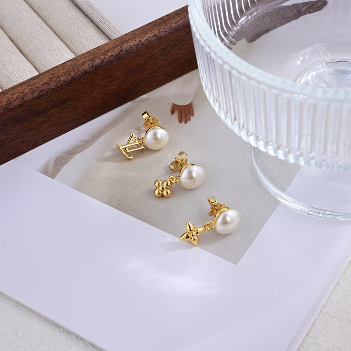 Martin Graham stud earrings in polished metal-tone – front product view