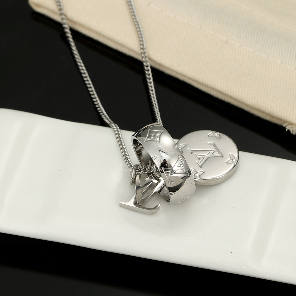 Martin Graham pendant necklace in polished metal-tone – close-up detail