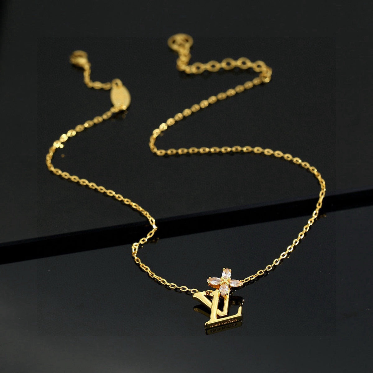 Martin Graham pendant necklace in polished metal-tone – close-up detail