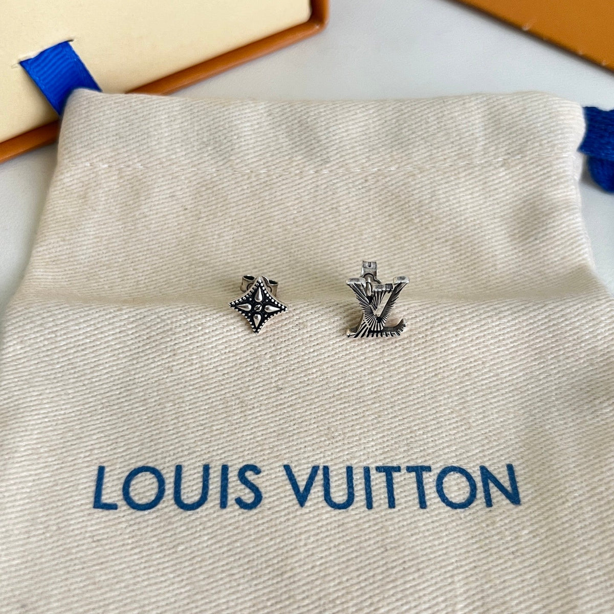 Martin Graham stud earrings in polished metal-tone – front product view