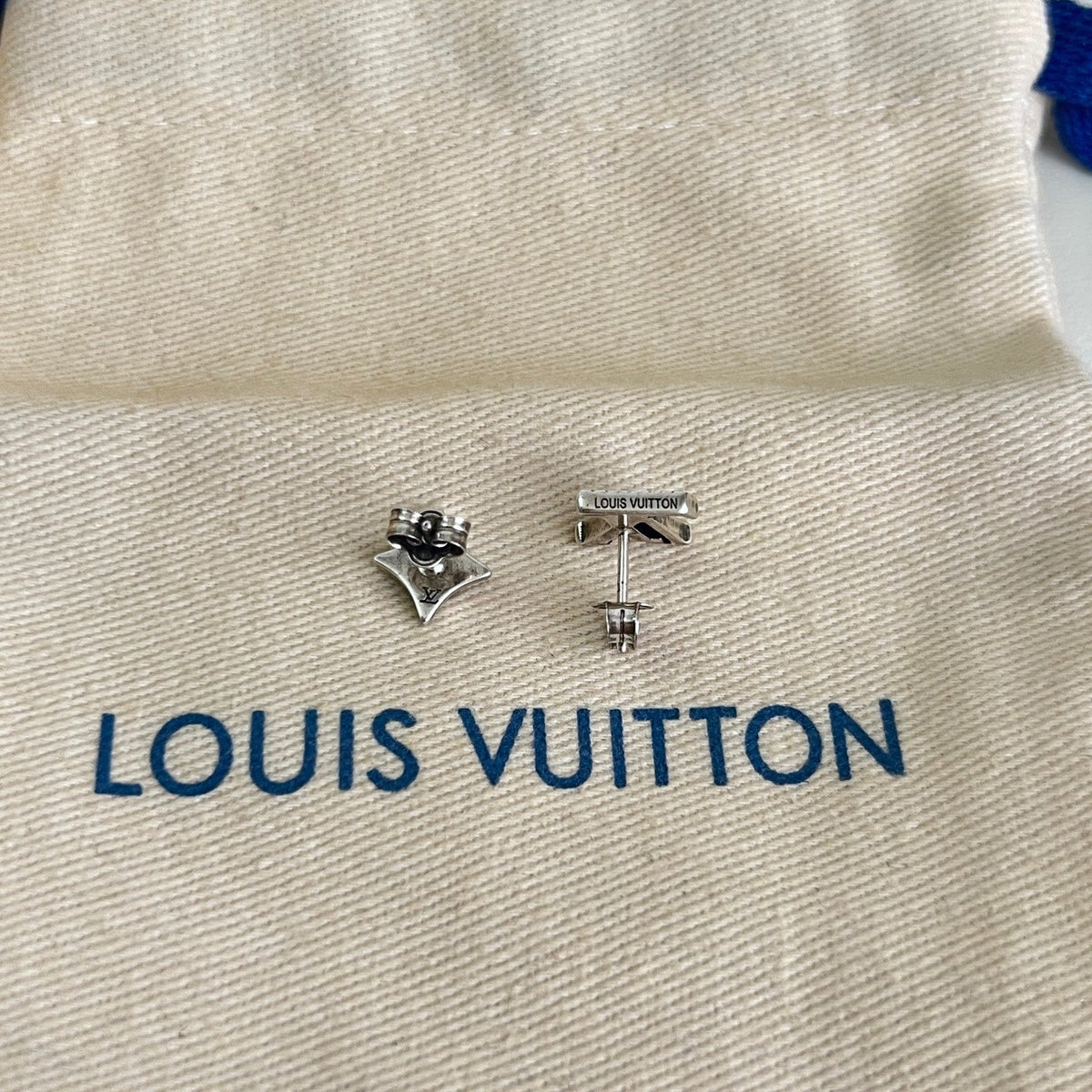 Martin Graham stud earrings in polished metal-tone – detail view
