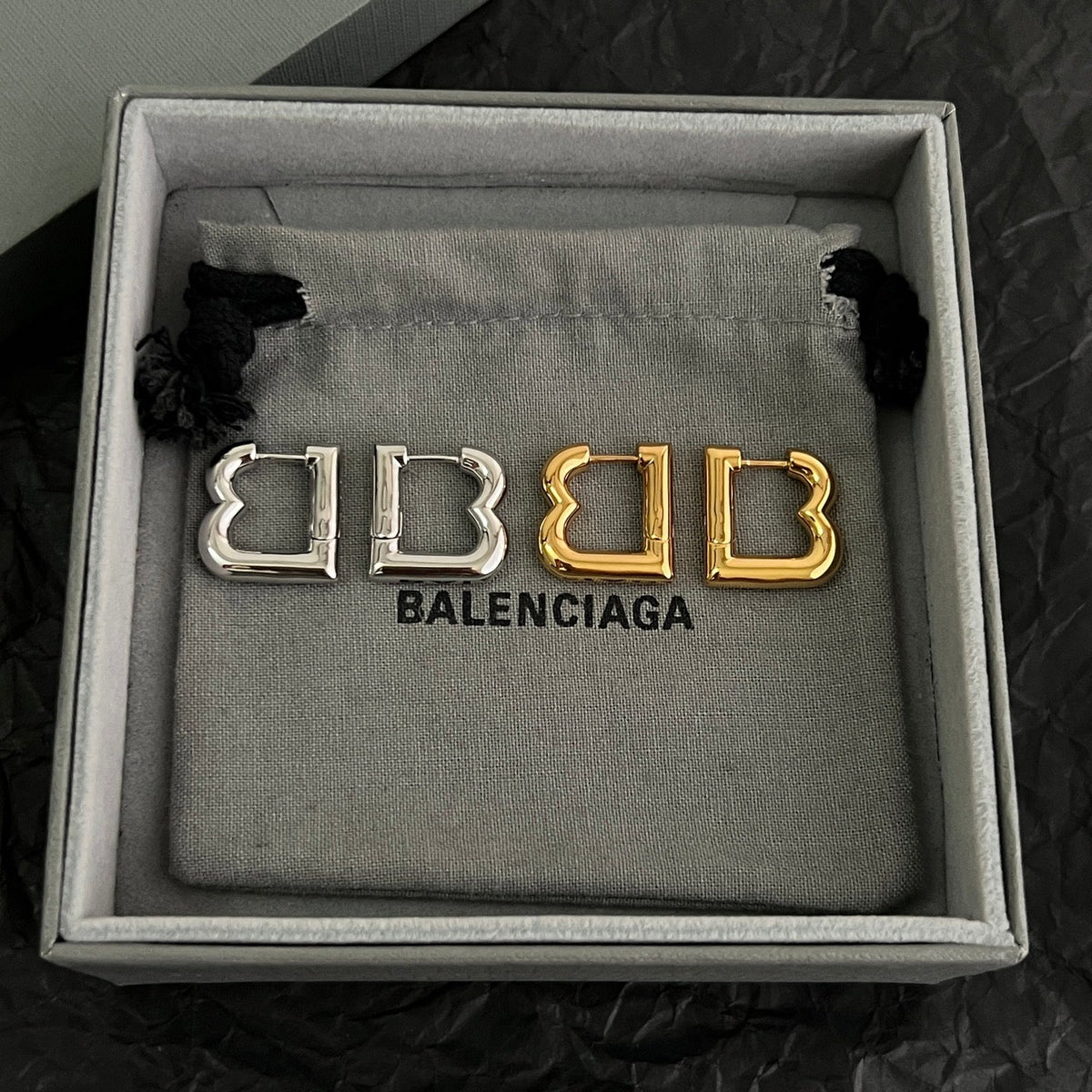 Martin Graham earrings in polished metal-tone – styled product view