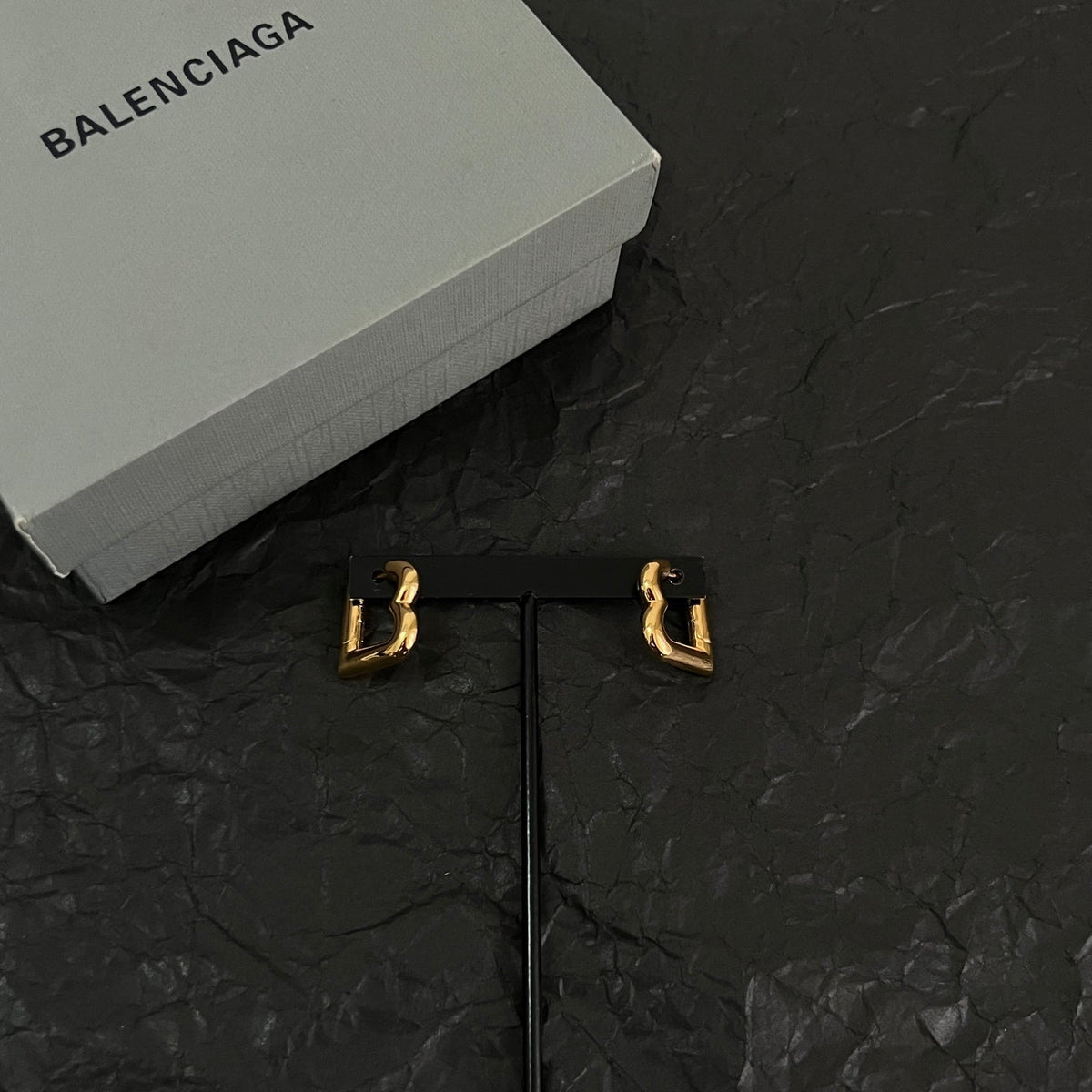 Martin Graham earrings in polished metal-tone – close-up detail