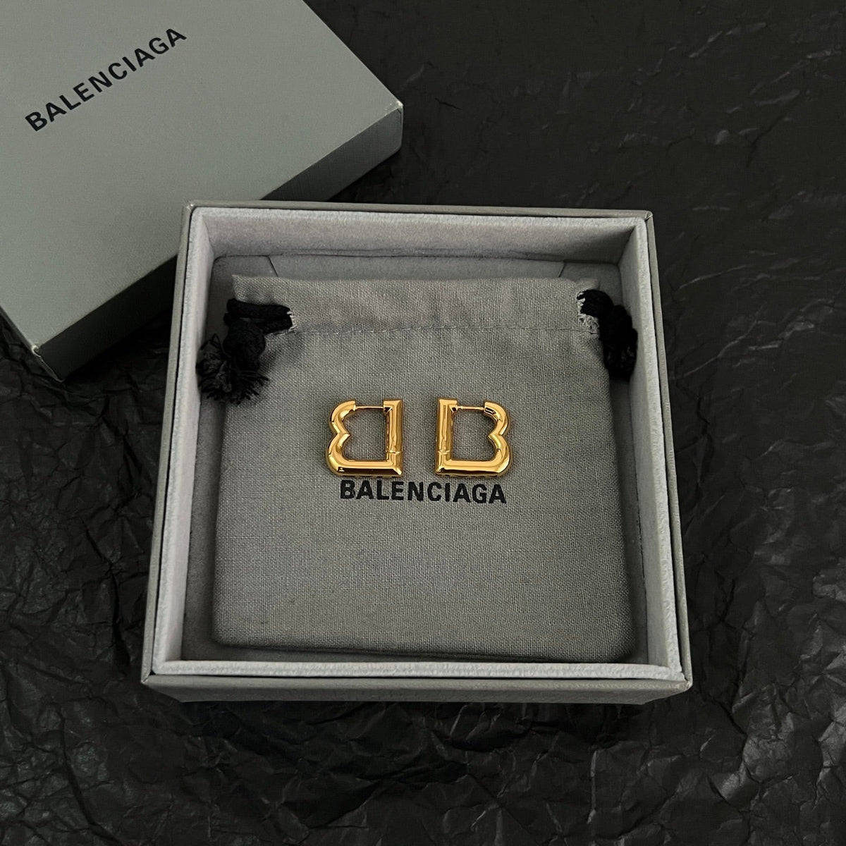 Martin Graham earrings in polished metal-tone – side detail