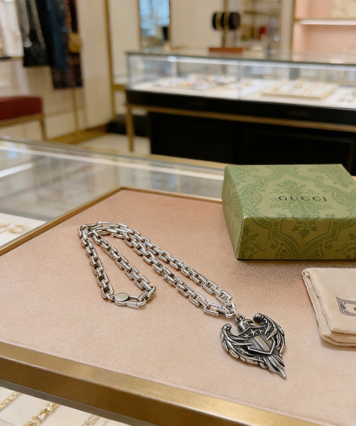 Martin Graham pendant necklace in polished metal-tone – detail view