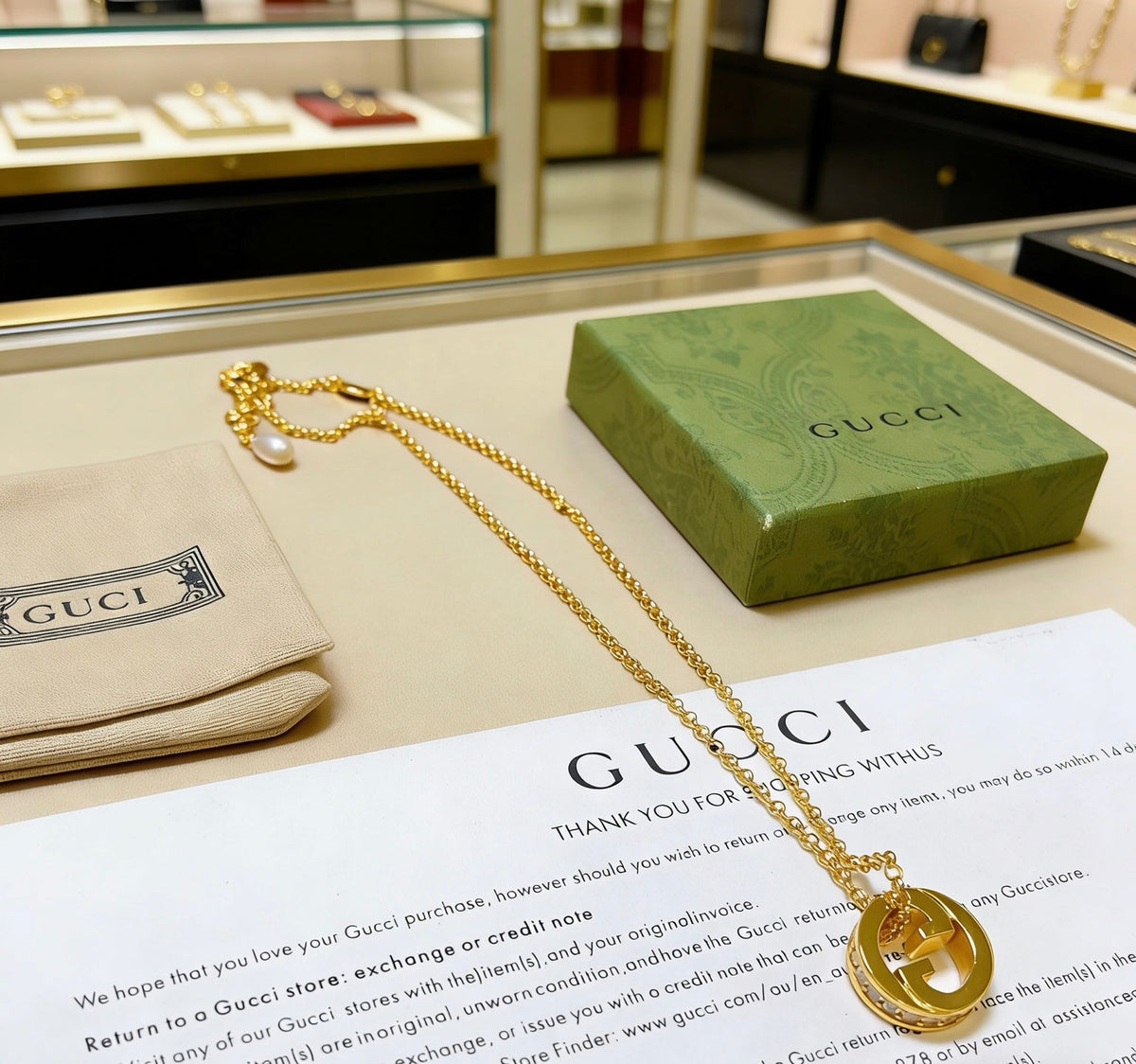 Martin Graham pendant necklace in polished metal-tone – side detail