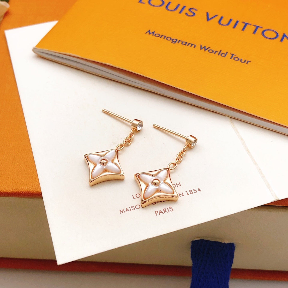 Martin Graham stud earrings in polished metal-tone – detail view