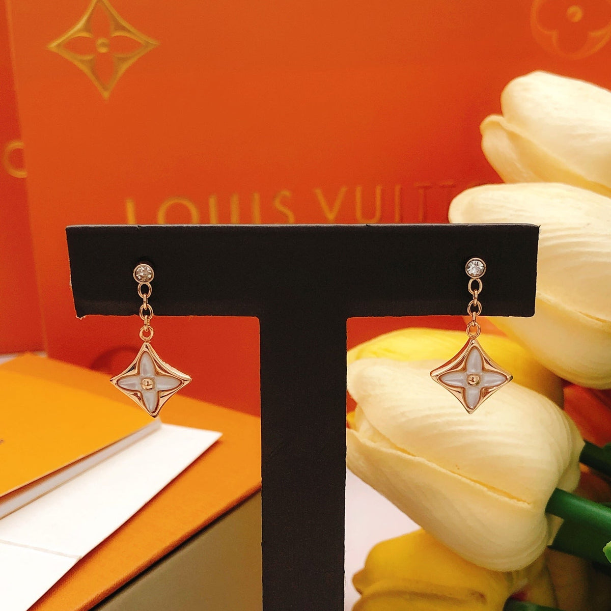 Martin Graham stud earrings in polished metal-tone – close-up detail