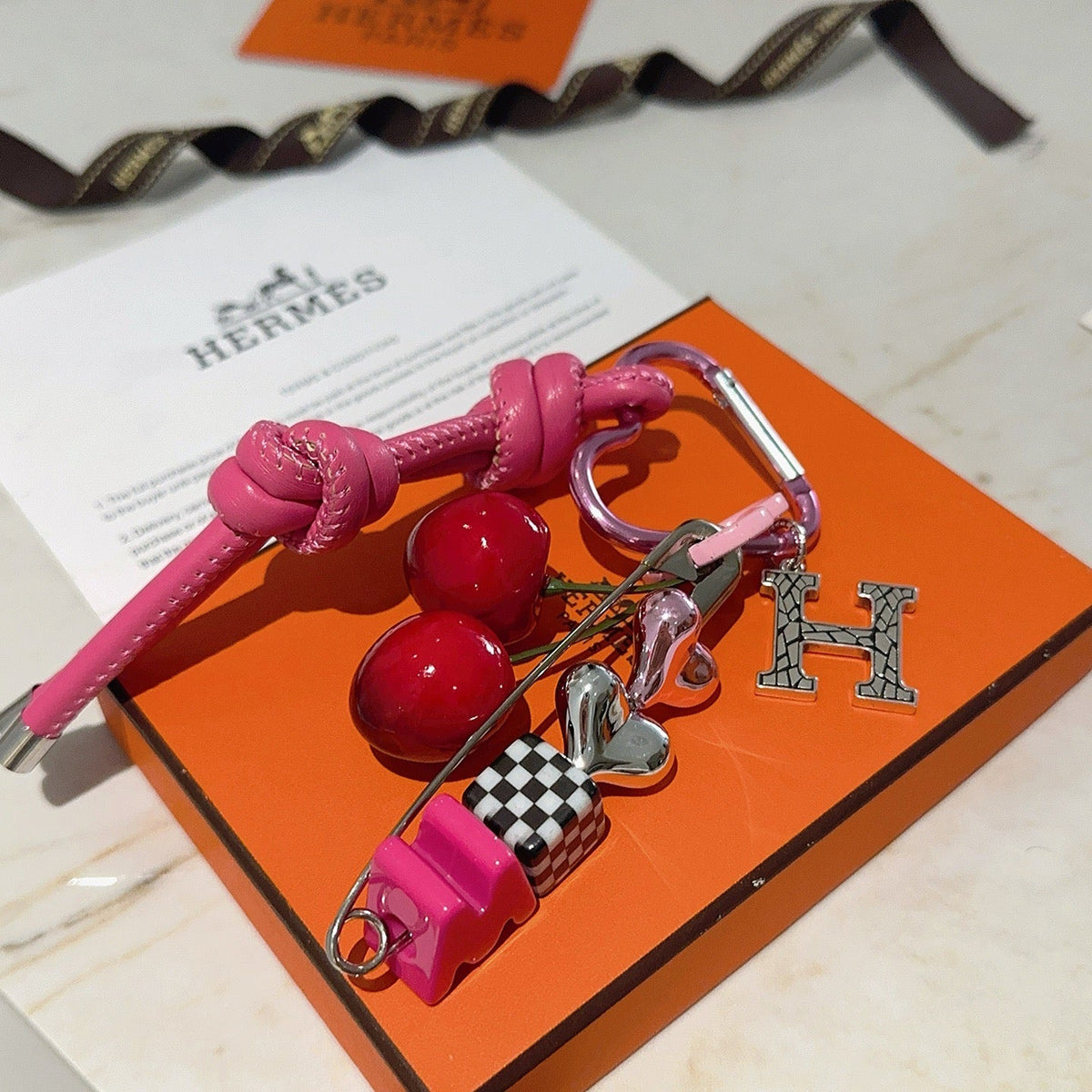 Martin Graham keychain in polished metal-tone – close-up detail