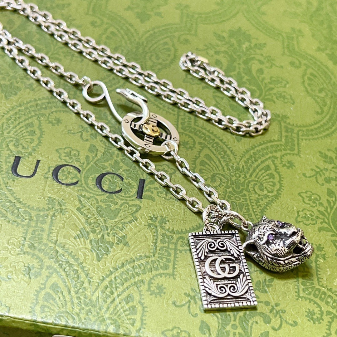 Martin Graham pendant necklace in polished metal-tone – detail view