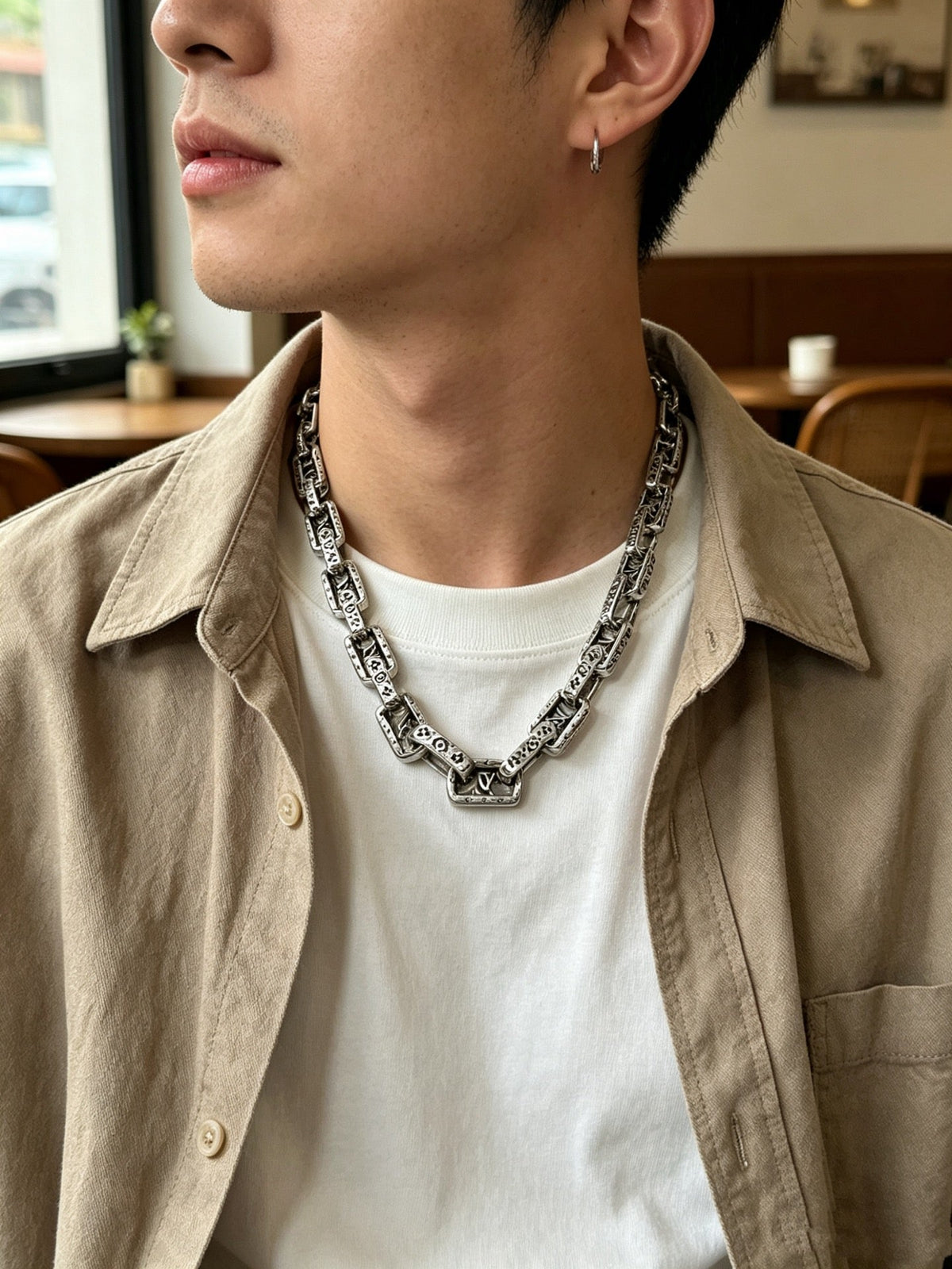 Martin Graham pendant necklace in polished metal-tone – close-up detail