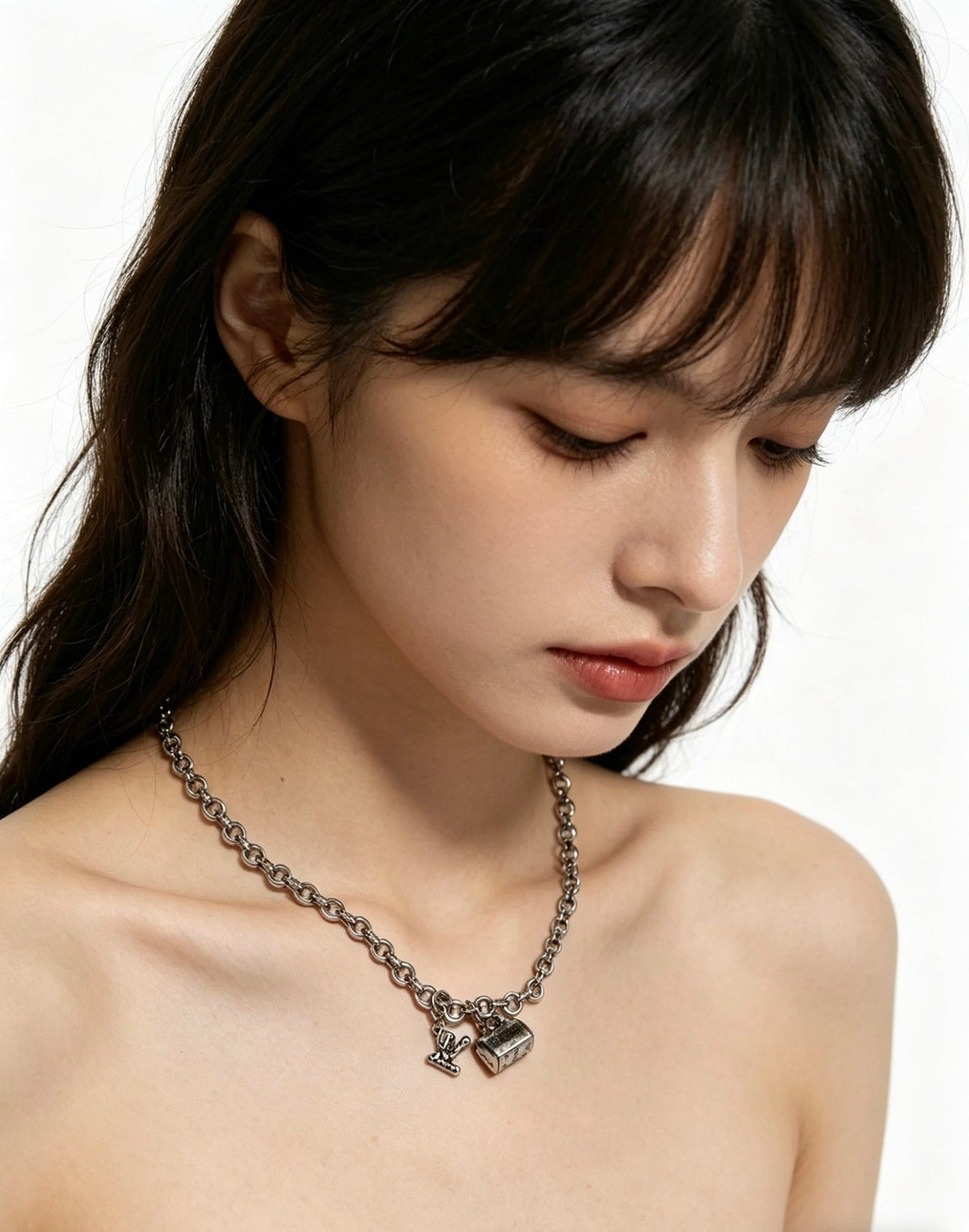 Martin Graham pendant necklace in polished metal-tone – side detail