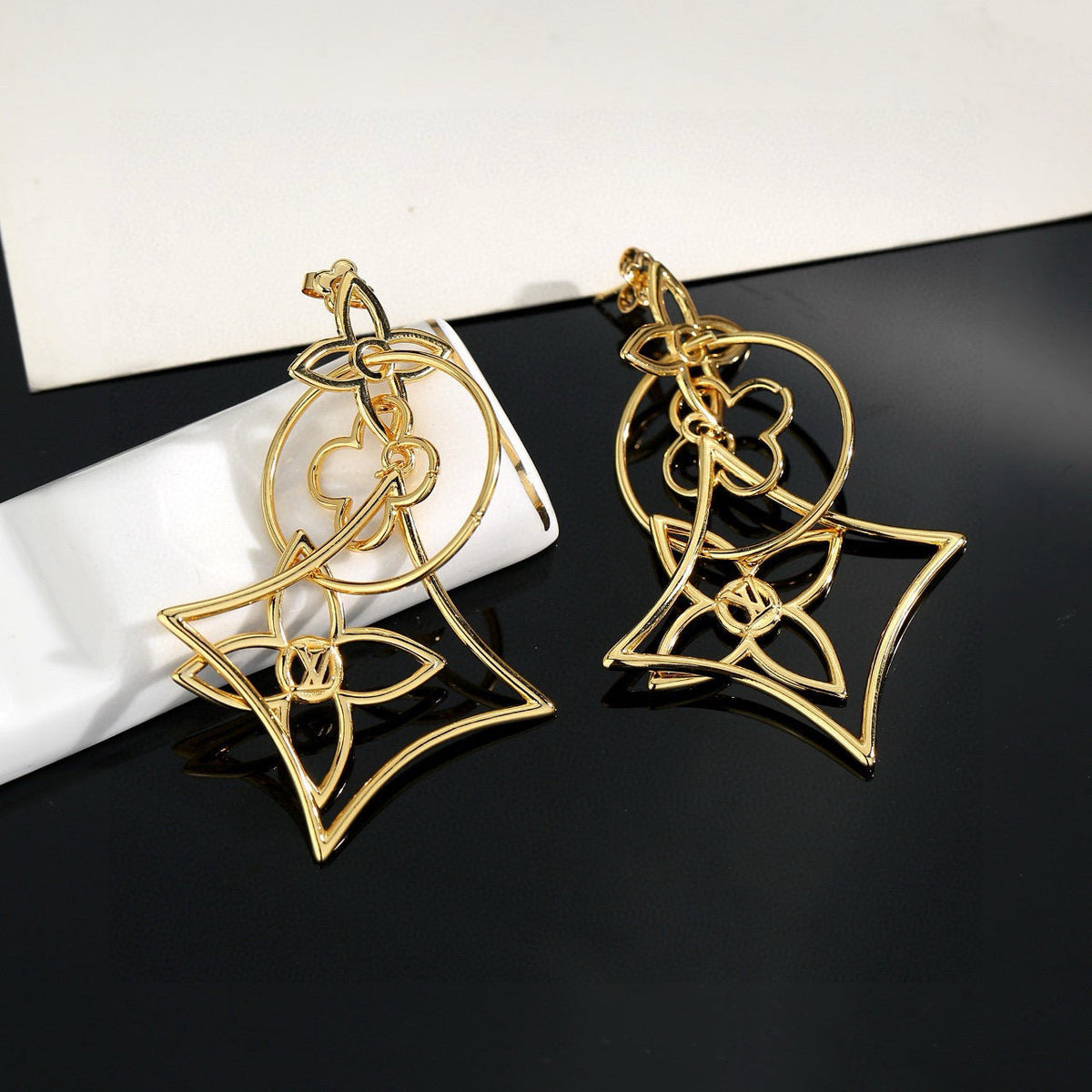 Martin Graham stud earrings in polished metal-tone – front product view