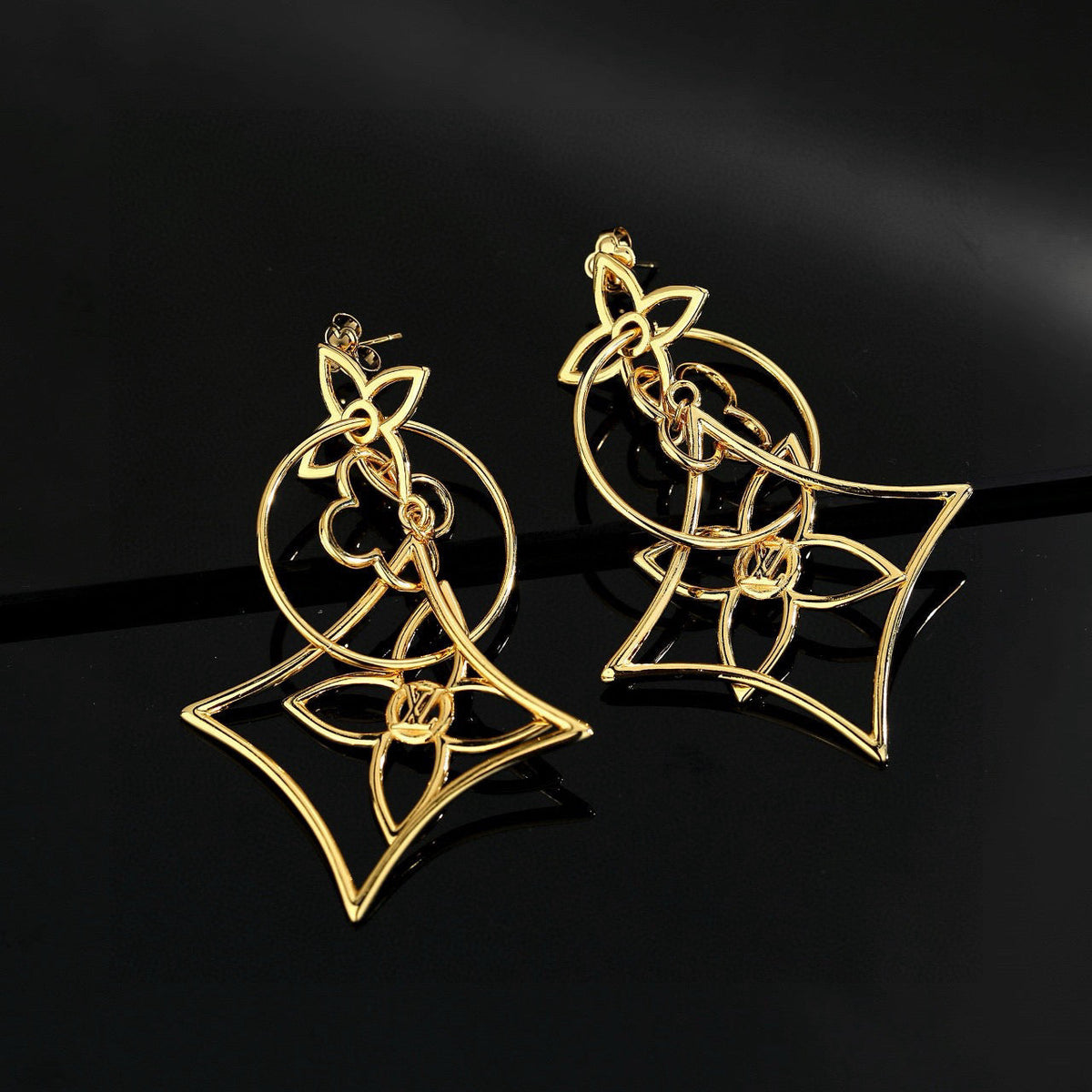 Martin Graham stud earrings in polished metal-tone – styled product view