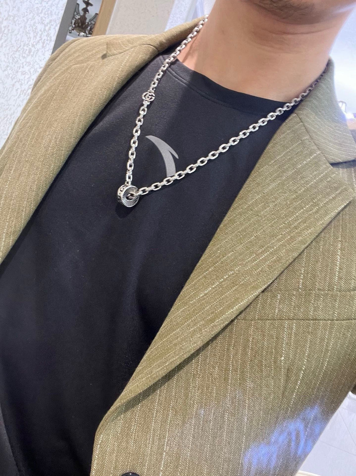Martin Graham pendant necklace in polished metal-tone – detail view