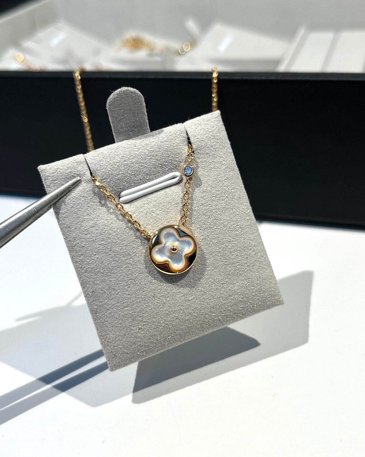 Martin Graham pendant necklace in polished metal-tone – side detail