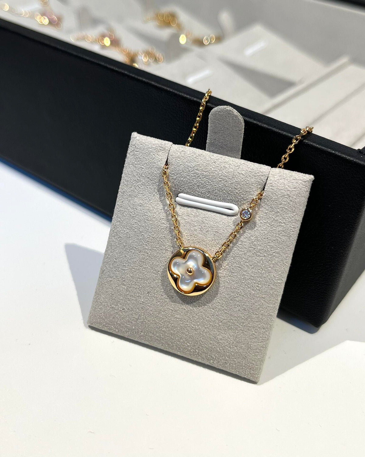 Martin Graham pendant necklace in polished metal-tone – close-up detail