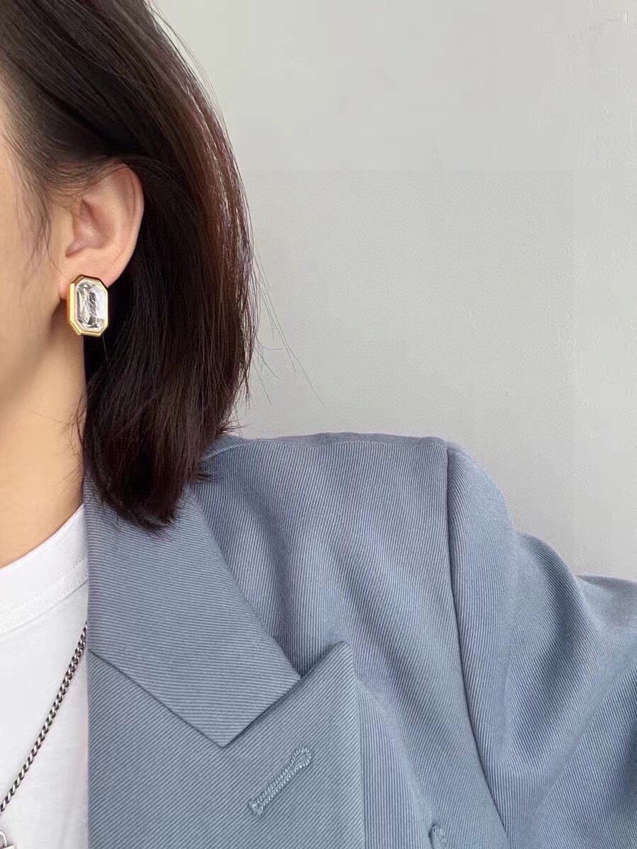 Martin Graham stud earrings in polished metal-tone – front product view