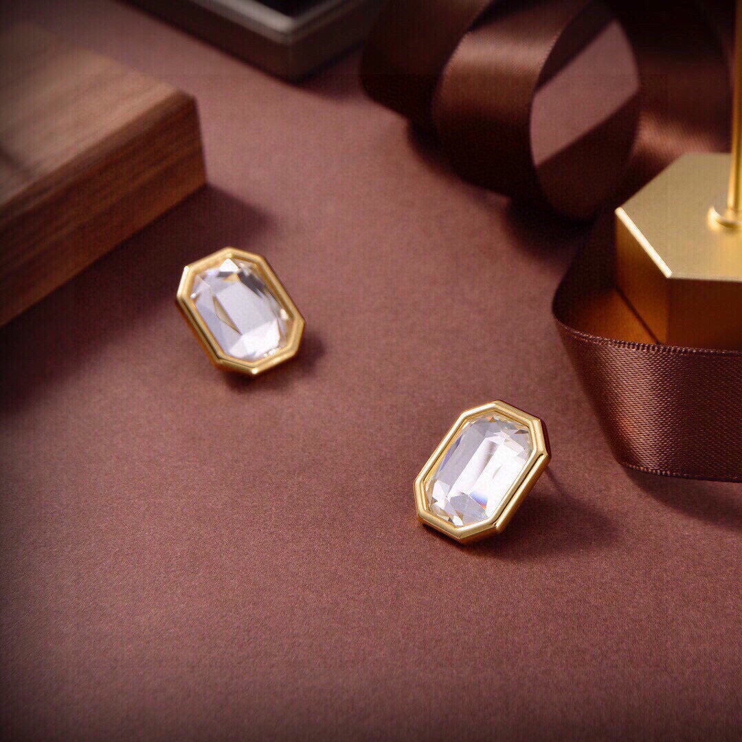 Martin Graham stud earrings in polished metal-tone – styled product view
